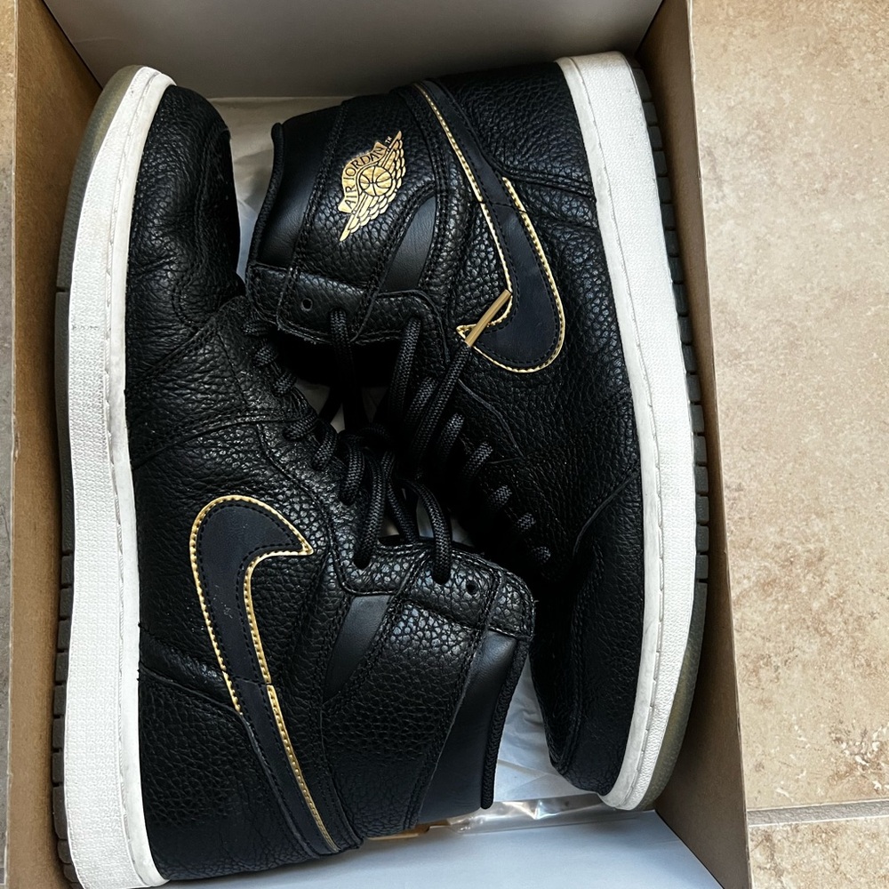 Nike Air Jordan Black and Gold High-Top Sneakers